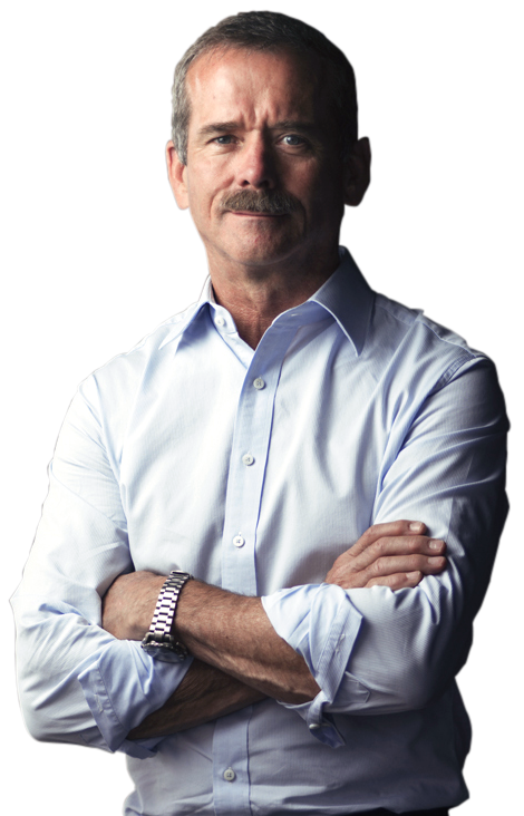 Chris Hadfield smiling with arms crossed